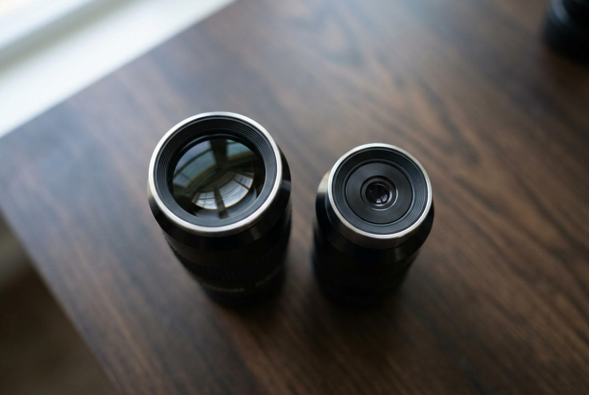 A 32mm and a 9mm 1.25-inch telescope eyepiece side by side, showing the much larger eye lens on the 32mm